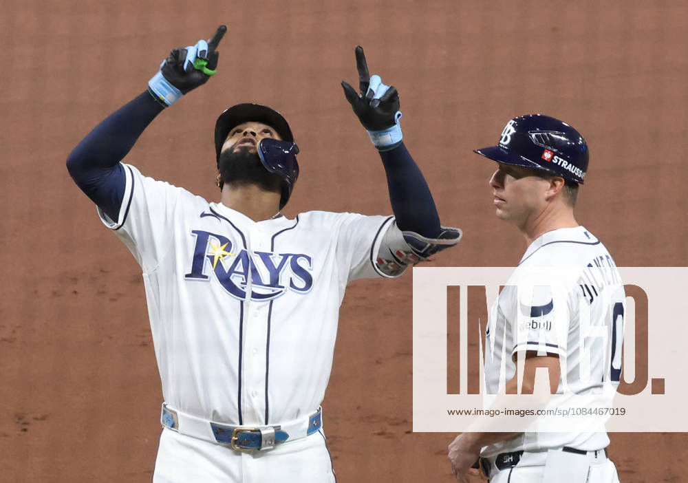 Tampa Bay Rays Junior Caminero (13) reacts on first base next to first base coach Corey Dickerson (10) after hitting an rbi-single against the Cleveland Guardians in the first inning in game one of the MLB, Baseball Herren, USA American League Championship Series playoff at Raymond James Stadium in Tampa, Florida, on Monday, October 12, 2026. TPB20261012704 GARYxBOGDON