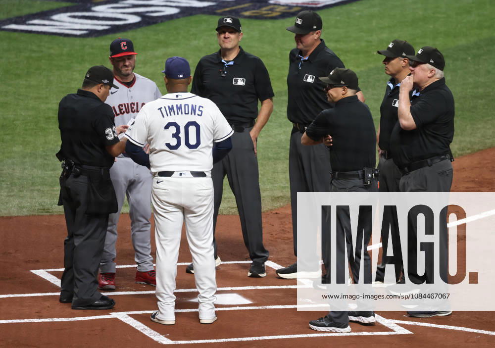 Tampa Bay Rays Ozzie Timmons (30) and Cleveland Guardians manager Stephen Vogt (12) meet with umpires at home plate before the start of their MLB, Baseball Herren, USA American League Championship Series playoff at Raymond James Stadium in Tampa, Florida, on Monday, October 12, 2026. TPB20261012706 GARYxBOGDON