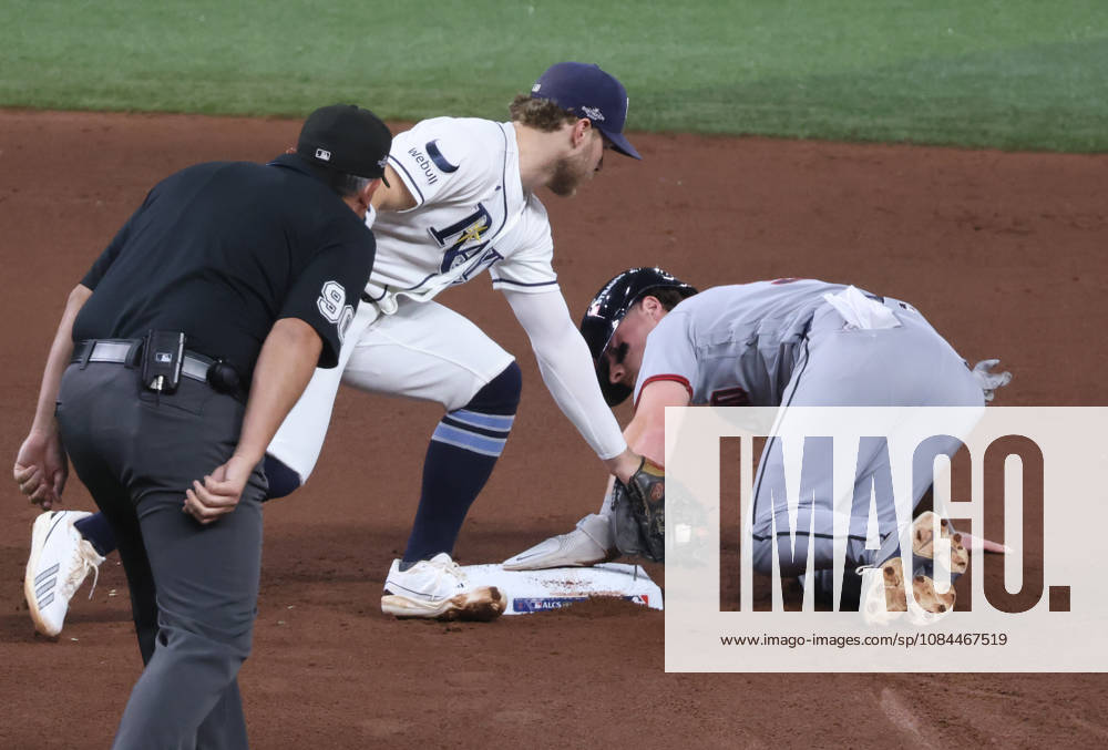 Cleveland Guardians Travis Bazzana (37) safely steals second past the tag of Tampa Bay Rays shortstop Taylor Walls (6) in the fourth inning in game one of the MLB, Baseball Herren, USA American League Championship Series playoff at Raymond James Stadium in Tampa, Florida, on Monday, October 12, 2026. TPB20261012710 GARYxBOGDON