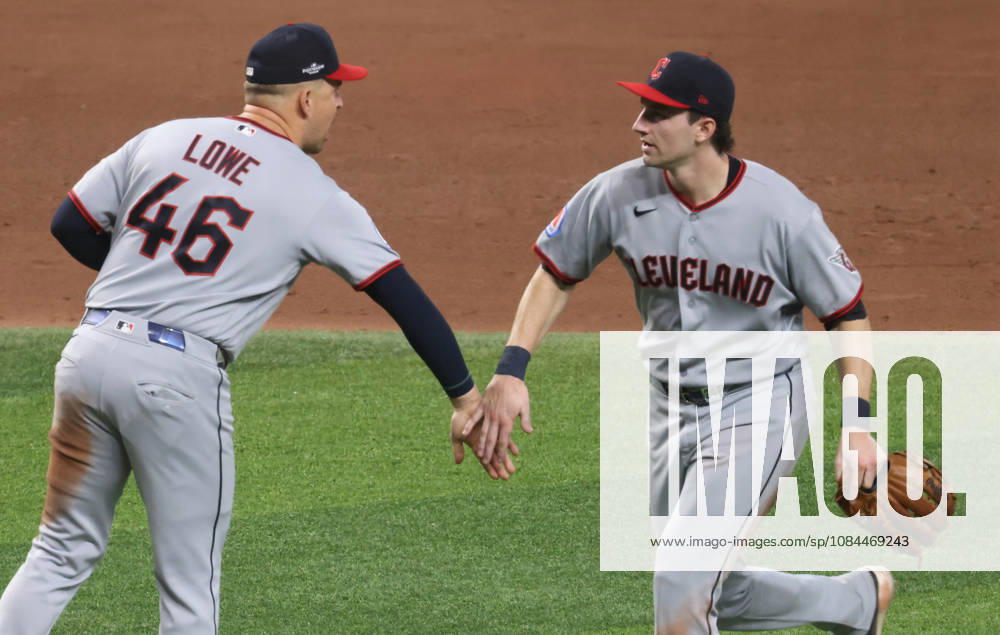 Cleveland Guardians first baseman Nathaniel Lowe (46) and second baseman Travis Bazzana celebrate after the Guardians defeated the Tampa Bay Rays 7-3 in game one of the MLB, Baseball Herren, USA American League Championship Series playoff at Raymond James Stadium in Tampa, Florida, on Monday, October 12, 2026. TPB202610127121 GARYxBOGDON