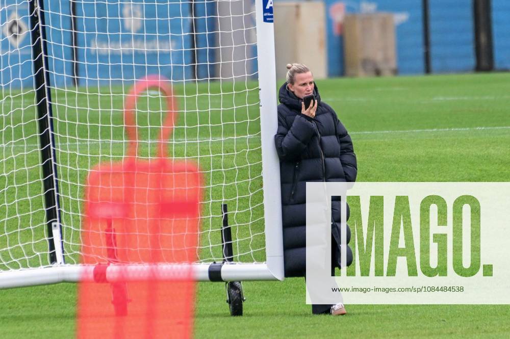 Kathleen Krüger, HSV s Director of Sports, talks on her cell phone; Germany, Hamburg, Volksparkstadion, soccer, Bundesliga 1, Hamburger SV training session