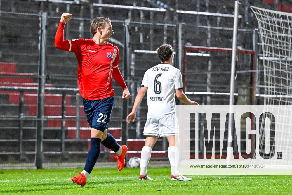 Goal scorer Cornelius Pfeiffer of Unterhaching, age 22, celebrating a goal, celebration, goal celebration, scoring a goal, celebrating the goal, goal, celebration, celebrating the goal that made it 2-0, optimistic, action, Lukas Bettrich of Landsberg, 6, looking disappointed, disappointment, frustration, pessimistic, October 13, 2026, Unterhaching, Germany, soccer, Bavarian Regional League, SpVgg Unterhaching vs. TSV 1882 Landsberg
