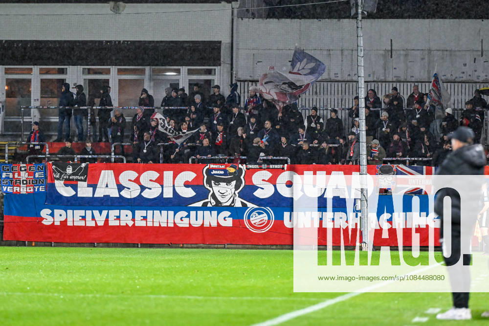 Unterhaching fans wave flags and cheer on their team; fans, crowd, spectators, excitement, atmosphere, stadium, October 13, 2026, Unterhaching, Germany, soccer, Bavarian Regional League, SpVgg Unterhaching vs. TSV 1882 Landsberg