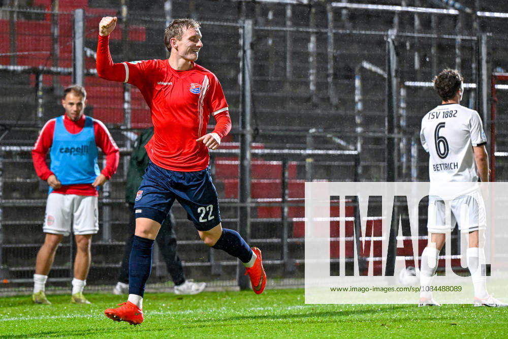 From left: Cornelius Pfeiffer of Unterhaching, 22, celebrating a goal; celebration; goal celebration; scoring a goal; celebrating the goal; goal; celebration; celebrating the 2-0 goal; optimistic; action; Lukas Bettrich of Landsberg, 6, looking disappointed, disappointment, frustration, disappointed, pessimistic, October 13, 2026, Unterhaching, Germany, soccer, Bavarian Regional League, SpVgg Unterhaching vs. TSV 1882 Landsberg