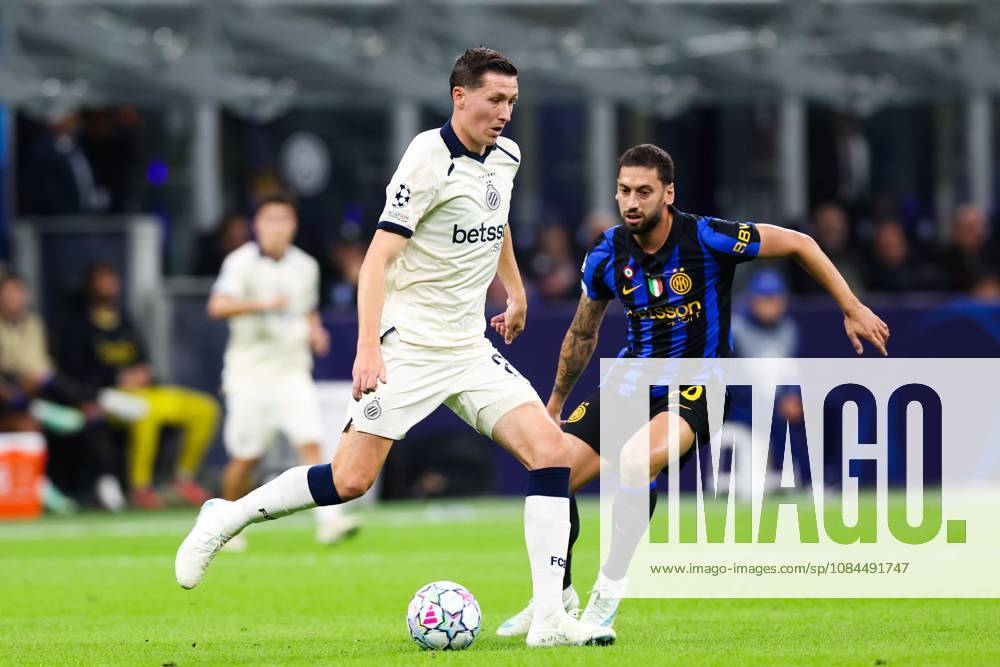Club s Hans Vanaken and Inter s Hakan Calhanoglu fight for the ball during a soccer game between Italian Inter Milan and Belgian Club Brugge KV, Tuesday 13 October 2026 in Milan, Italy, on day 2 of the UEFA Champions League league phase. BRUNOxFAHY x189711695x