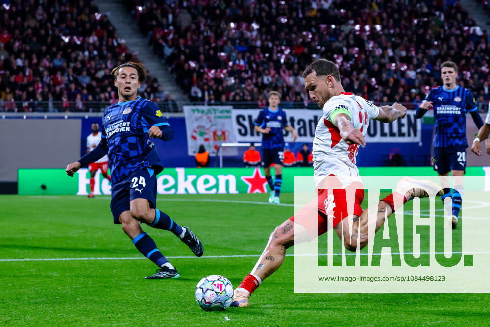 David Raum (RB Leipzig), 22, takes a shot; Kodai Sano (PSV Eindhoven), 24, blocks it; GER; RB Leipzig vs. PSV Eindhoven; soccer; UEFA Champions League; Matchday 2; 2026–2027 season; October 13, 2026, GER, RB Leipzig vs. PSV Eindhoven, soccer, UEFA Champions League, Matchday 2, 2026–2027 season, October 13, 2026, Germany