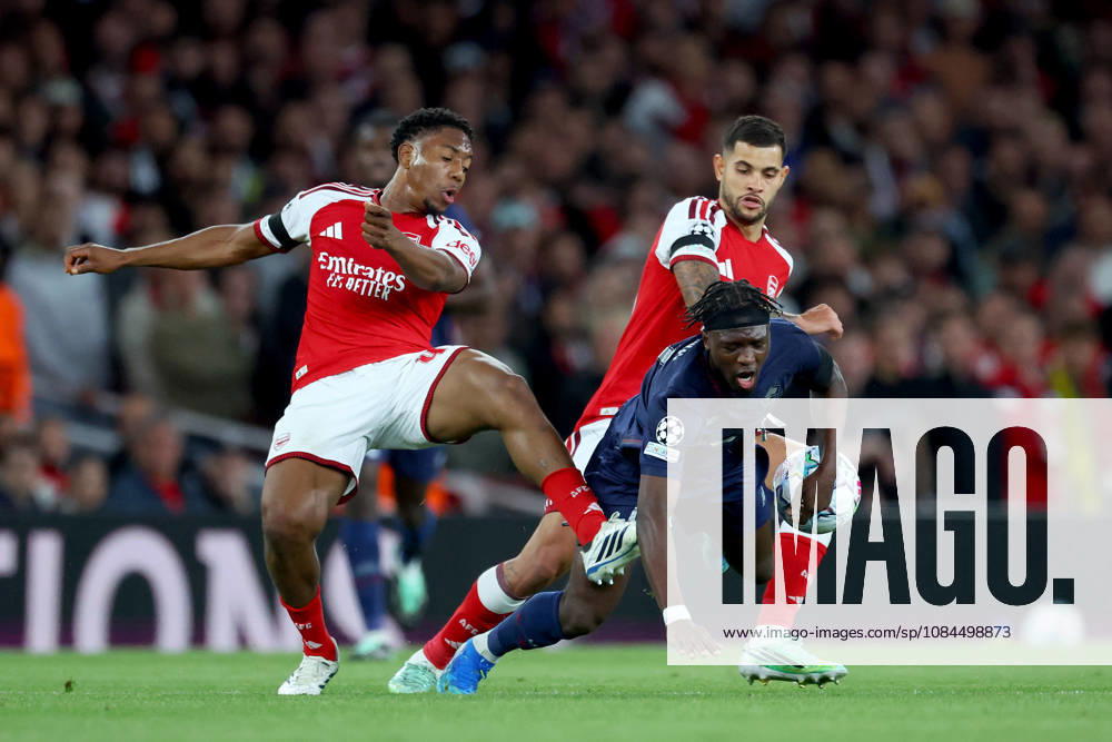 Arsenal FC v LOSC Lille - UEFA Champions League 2026 27 League Phase MD2 Myles Lewis-Skelly of Arsenal, Dilane Bakwa of LOSC Lille and Bruno Guimaraes of Arsenal challenge during the UEFA Champions League 2026 27 League Phase MD2 match between Arsenal FC and LOSC Lille at Arsenal Stadium on October 13, 2026 in London, England. London Arsenal Stadium England United Kingdom