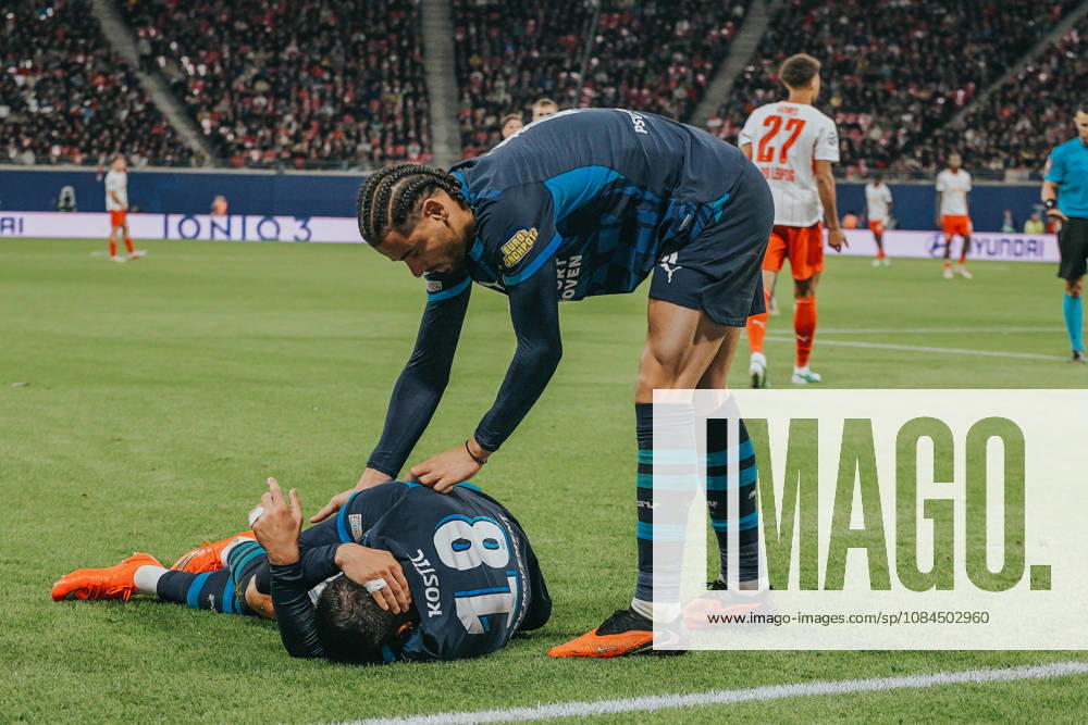 Champions League, Matchday 2, RB Leipzig vs. PSV Eindhoven, October 13, 2026, starting at 9:00 p.m., Leipzig, Red Bull Arena. In the photo: 18 Filip Kostic (injured), 04 Armando Obispo. Champions League, Matchday 2, RB Leipzig vs. PSV Eindhoven, Leipzig, Saxony, Germany