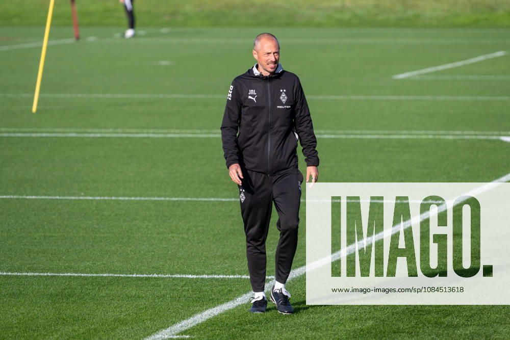 Niklas Lanwehr, Borussia Mönchengladbach assistant coach, picks up training equipment. Borussia Mönchengladbach public training session, soccer, Bundesliga, 2026–2027 season, October 14, 2026: Borussia Mönchengladbach public training session, soccer, Bundesliga, 2026–2027 season, October 14, 2026, Mönchengladbach