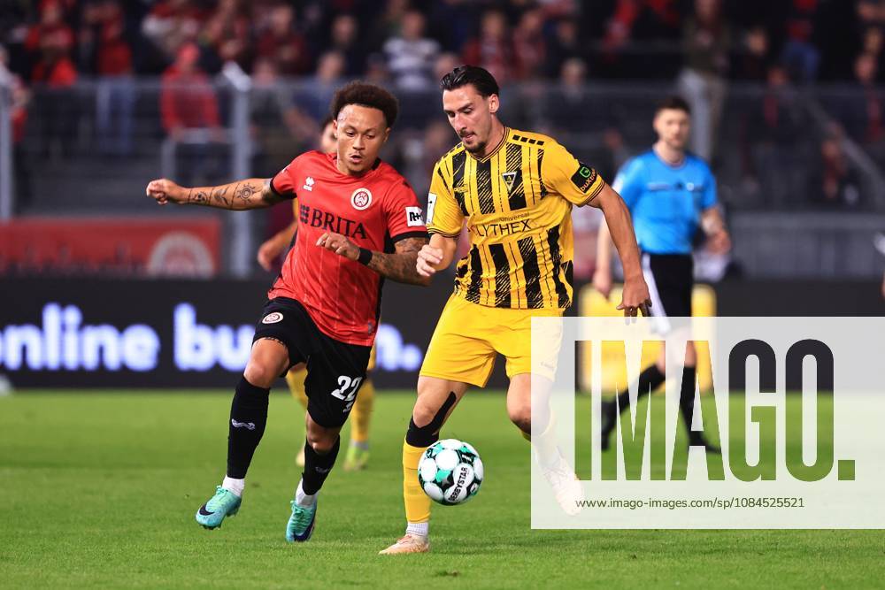 Petros Bagkalianis of Alemannia Aachen, No. 02, in a tackle with Roberto Massimo of SV Wehen Wiesbaden, No. 22 (GER), SV Wehen Wiesbaden vs. Alemannia Aachen, soccer, 3. Liga, Matchday 9, 2026–2027 season, October 14, 2026 DFB regulations prohibit any use of photographs as image sequences and or quasi-video GER, SV Wehen Wiesbaden vs. Alemannia Aachen, soccer, 3rd Division, Matchday 9, 2026–2027 season, October 14, 2026, Wiesbaden