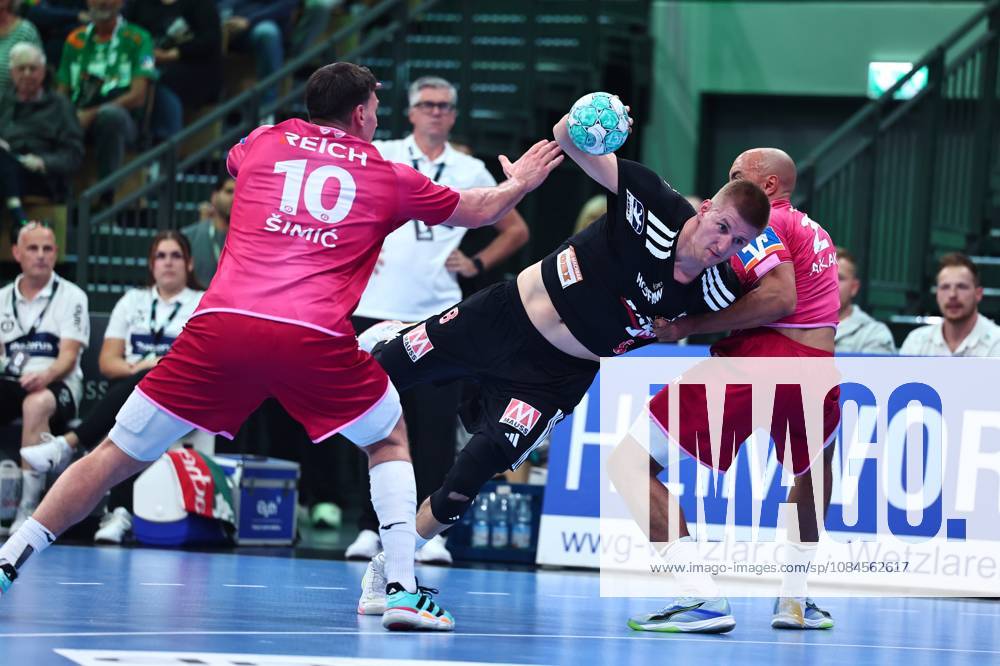 Sander Andreassen Oeverjordet of HC Erlangen, No. 08, in a one-on-one battle with Josip Simic of HSG Wetzlar (left) and David Cyrill Akakpo of HSG Wetzlar GER, HSG Wetzlar vs. HC Erlangen, Handball, Opel Handball Bundesliga, Matchday 9, 2026–2027 season, October 15, 2026, GER, HSG Wetzlar vs. HC Erlangen, Handball, Opel Handball Bundesliga, Matchday 9, 2026–2027 season, October 15, 2026, Wetzlar