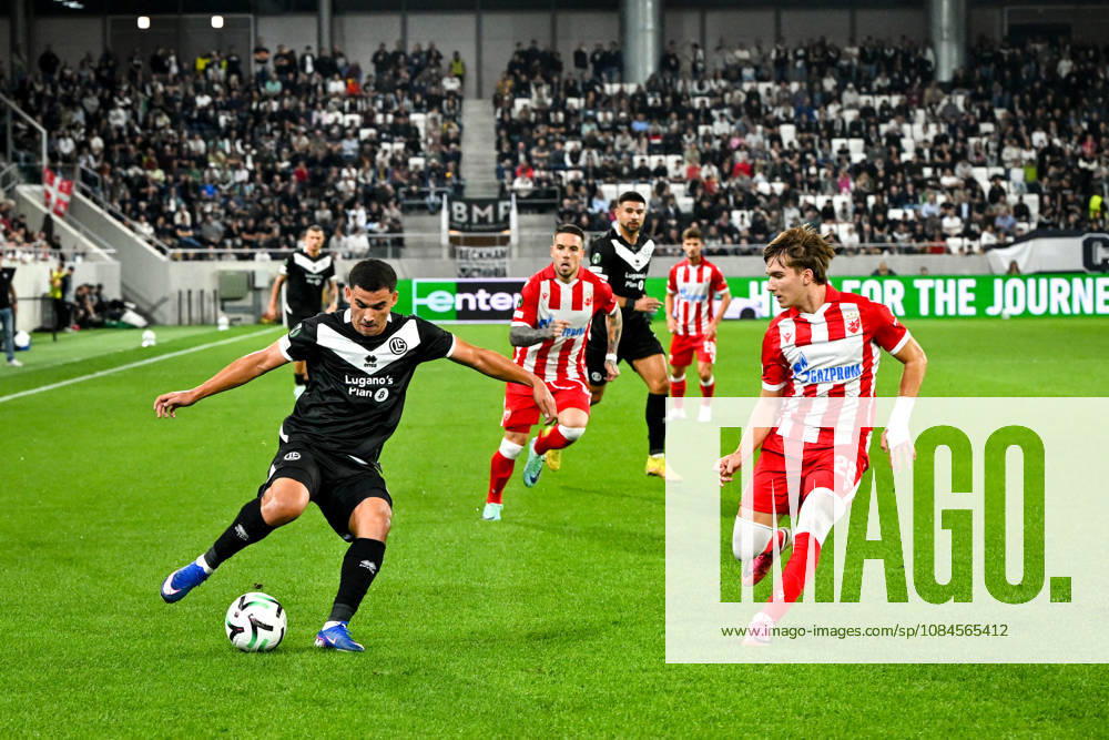 LUGANO, SWITZERLAND OCTOBER 15 Bekhruz Karimov of FC Lugano in action against Vasilije Kostov of FK Crvena Zvezda during the UEFA Conference League 2026–27 Group Stage Matchday 1 match between FC Lugano and FK Crvena Zvezda at Lugano Arena on October 15, 2026, in Lugano, Switzerland; Lugano, Lugano Arena, Ticino, Switzerland