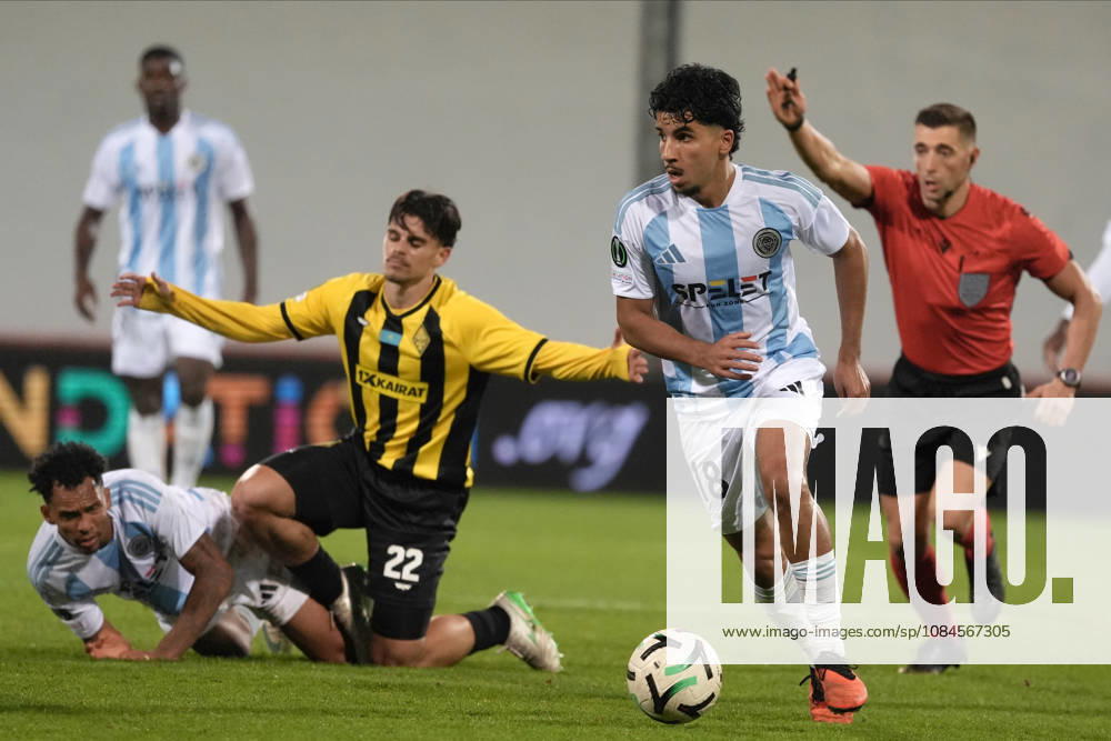 Salah Oulad M Hand of Riga FC and Gustavo Mendonca of Kairat compete for the ball during a UEFA Conference League soccer match between Latvias Riga FC and Kazakhstans Kairat Almaty at Skonto Stadium in Riga, Latvia, Thursday, Oct. 15, 2026. Riga Latvia