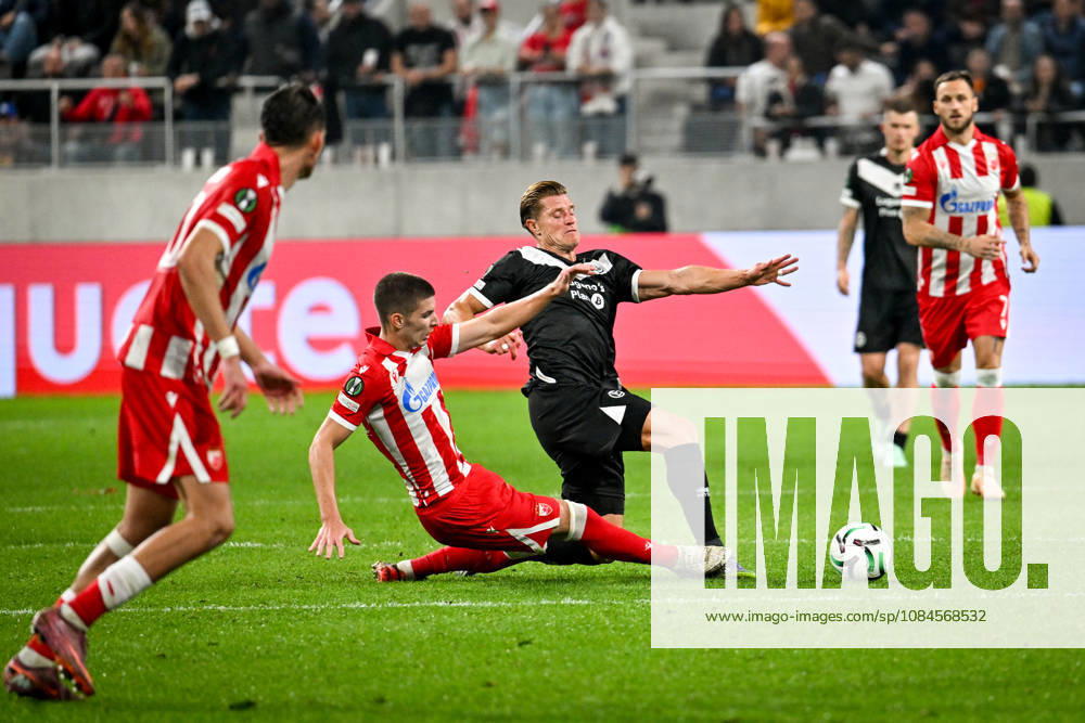LUGANO, SWITZERLAND OCTOBER 15 Stefan Gudelj of FK Crvena Zvezda and Kevin Behrens of FC Lugano battle for the ball during the UEFA Conference League 2026–27 League Phase Matchday 1 game between FC Lugano and FK Crvena Zvezda at Lugano Arena on October 15, 2026, in Lugano, Switzerland—Lugano Arena, Ticino, Switzerland