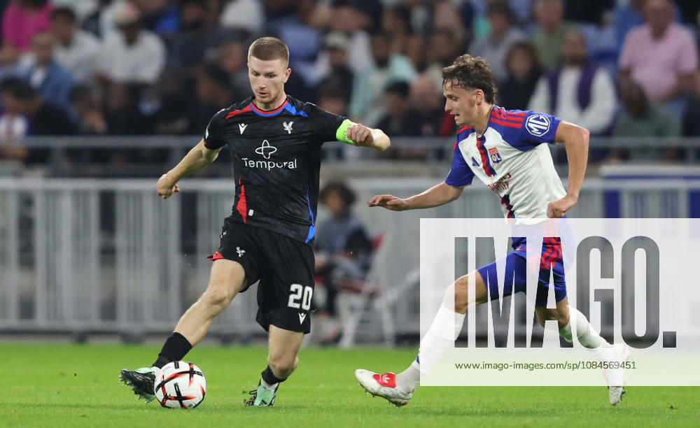 DECINES-CHARPIEU, FRANCE, OCTOBER 15: Adam Wharton of Crystal Palace FC controls the ball under pressure from Tyler Morton of Olympique Lyonnais during the UEFA Europa League 2026 27 League Phase MD2 match between Olympique Lyonnais and Crystal Palace FC at OL Stadium on October 15, 2026 in Decines-Charpieu, France (Photo by Daniel Weir Sports Press Photo SPP)