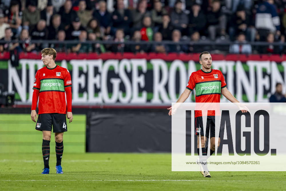 NIJMEGEN — NEC Nijmegen defender Perr Schuurs and NEC Nijmegen midfielder Darko Nejaömic look dejected during the UEFA Europa League match between NEC and Levski Sofia at Stadion De Goffert on October 15, 2026, in Nijmegen, Netherlands. Photo by DeFodi Images