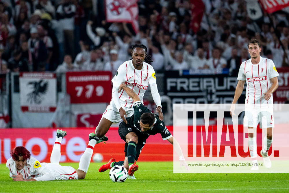 GER, Soccer, Men s, UEFA Conference League, 2026–2027 Season, Matchday 1, SC Freiburg vs. FK Jablonec: Jordy Makengo (SC Freiburg, No. 33) in a tackle with Vakhtang Tchanturishvili (FK Jablonec, No. 7), with Keisuke Goto (SC Freiburg, No. 42) nearby; Freiburg, Europapark Stadium, Baden-Württemberg, Germany