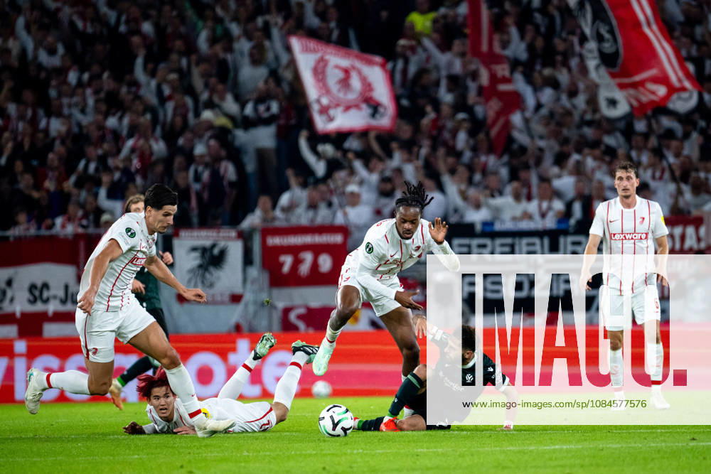 GER, Soccer, Men s, UEFA Conference League, 2026–2027 Season, Matchday 1, SC Freiburg vs. FK Jablonec: Jordy Makengo (SC Freiburg, 33) in a tackle with Vakhtang Tchanturishvili (FK Jablonec, 7), with Keisuke Goto (SC Freiburg, 42, Igor Matanovic (SC Freiburg), 31; Freiburg, Europapark Stadium, Baden-Württemberg, Germany