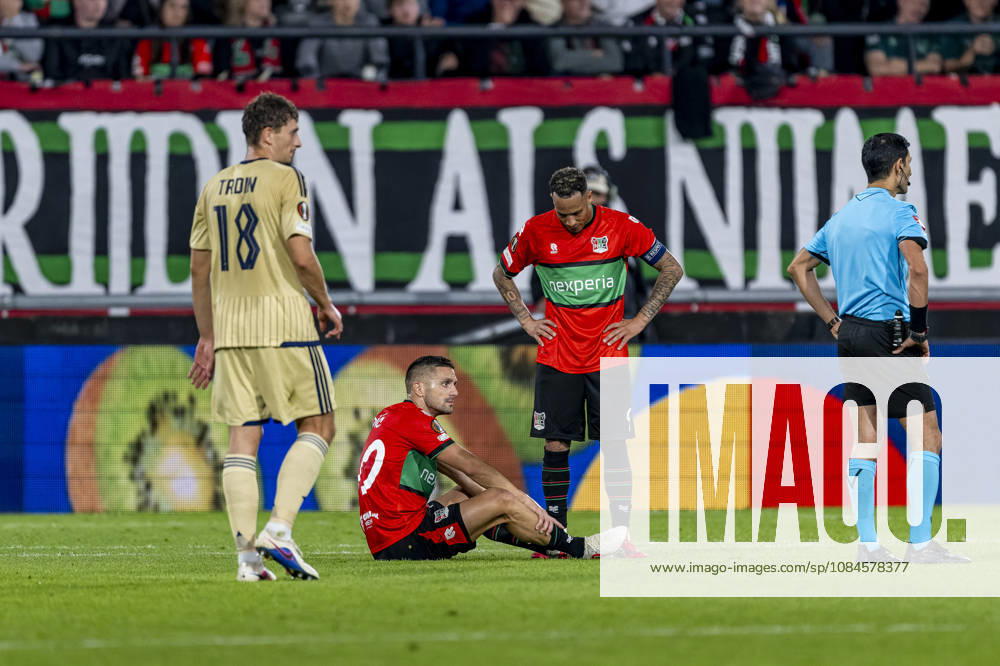 NIJMEGEN NEC Nijmegen forward Duöan Tadic sits injured on the ground, NEC Nijmegen forward Tjaronn Chery during the UEFA Europa League match between NEC and Levski Sofia at Stadion De Goffert on October 15, 2026, in Nijmegen, the Netherlands. Photo by DeFodi Images