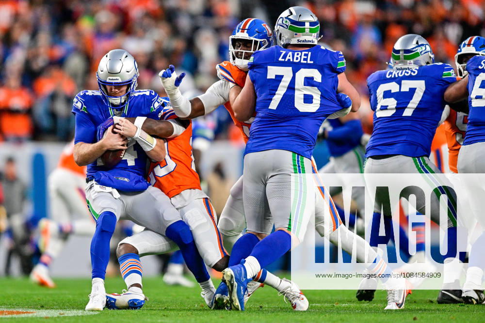 DENVER, CO - OCTOBER 15: Seattle Seahawks quarterback Sam Darnold (14) is sacked in the first quarter during a game between the Seattle Seahawks and the Denver Broncos at Empower Field at Mile High on October 15, 2026 in Denver, Colorado. (Photo by Dustin Bradford Icon Sportswire) NFL, American Football Herren, USA OCT 15 Seahawks at Broncos Icon132261015019