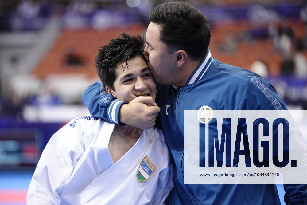 2026 World Cadet, Junior & U21, U 21 Karate Championships BIELSKO-BIALA, POLAND - OCTOBER 16: Javokhir Djakhangirov of Uzbekistan celebrates victory with his coach after winning the cadet male individual kata semi-final at the 2026 World Cadet, Junior & U21 Karate Championships at Hala Pod Debowcem on October 16, 2026 in Bielsko-Biala, Poland. Bielsko-Biala Hala Pod Debowcem Poland