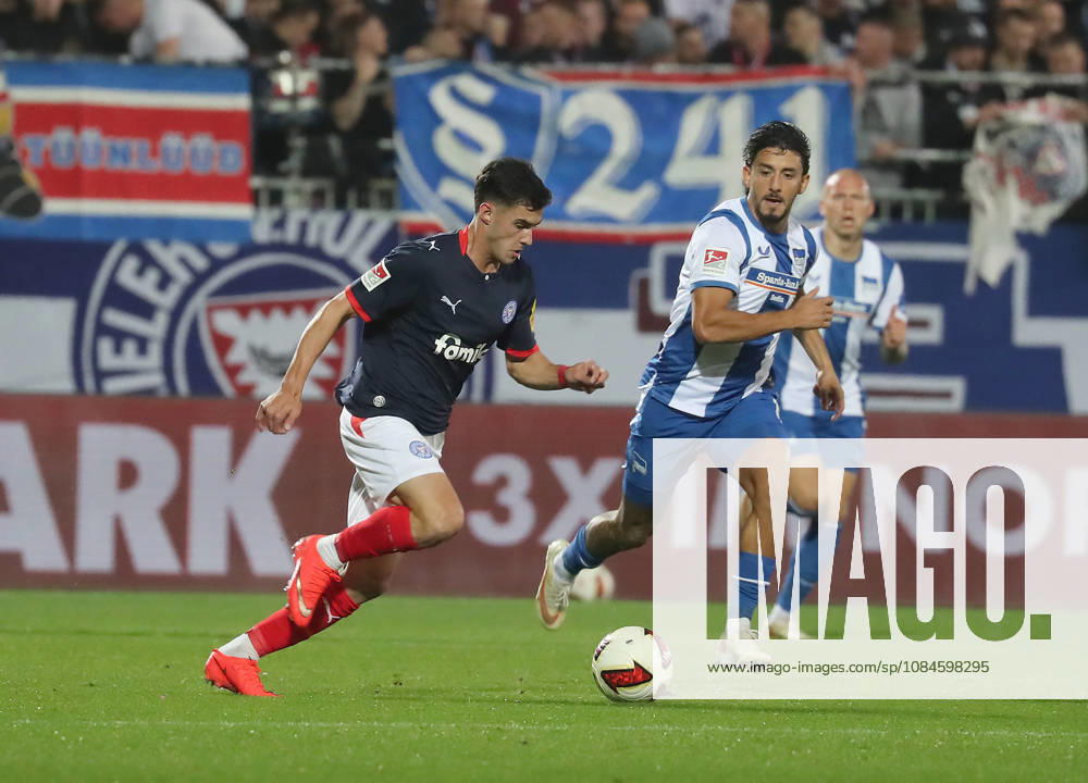 Guillermo Balzi, Holstein Kiel; Kevin Sessa, Hertha BSC Berlin; Soccer, Men s, 2026–2027 Season, 2. Bundesliga, Holstein Stadium, Holstein Kiel vs. Hertha BSC Berlin. DFL regulations prohibit any use of photographs as image sequences and or quasi-video.