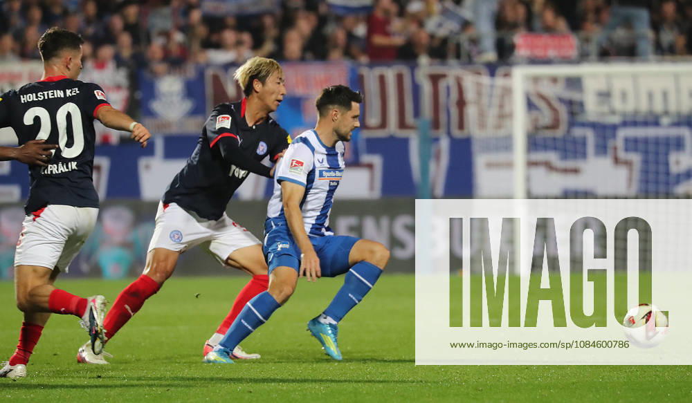 Hiroki Sekine, Holstein Kiel; Josip Brekalo, Hertha BSC Berlin; Soccer, Men s, 2026–2027 Season, 2. Bundesliga, Holstein Stadium, Holstein Kiel vs. Hertha BSC Berlin. DFL regulations prohibit any use of photographs as image sequences and or quasi-video.