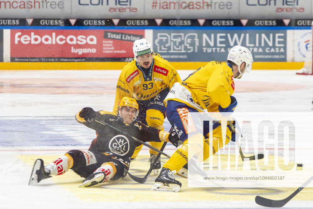 LUGANO, SWITZERLAND OCTOBER 16 Top scorer Jere Innala of Lugano (L) faces off against Yannick Frehner of Davos (C) and Filip Zadina of Davos (R) during the game between HC Lugano and HC Davos at the Corner Arena on October 16, 2026, in Lugano, Switzerland, Lugano, Ticino, Switzerland