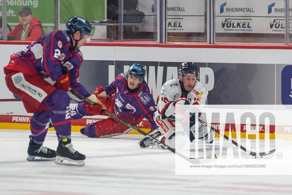 Andreas Doepfner of EHC Freiburg, No. 12, tries to play the puck even while sliding. DEG vs. EHC Freiburg, Ice Hockey, DEL2, Matchday 9, 2026–2027 Season, October 16, 2026, DEG vs. EHC Freiburg, Ice Hockey, DEL2, Matchday 9, 2026–2027 Season, October 16, 2026, Düsseldorf