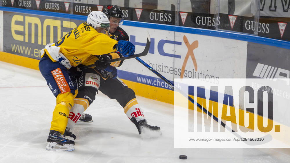 LUGANO, SWITZERLAND, OCTOBER 16: Guus Van der Kaaij of Davos (L) faces off against Olle Lycksell of Lugano (R) during the game between HC Lugano and HC Davos at the Corner Arena on October 16, 2026, in Lugano, Switzerland, Ticino, Switzerland