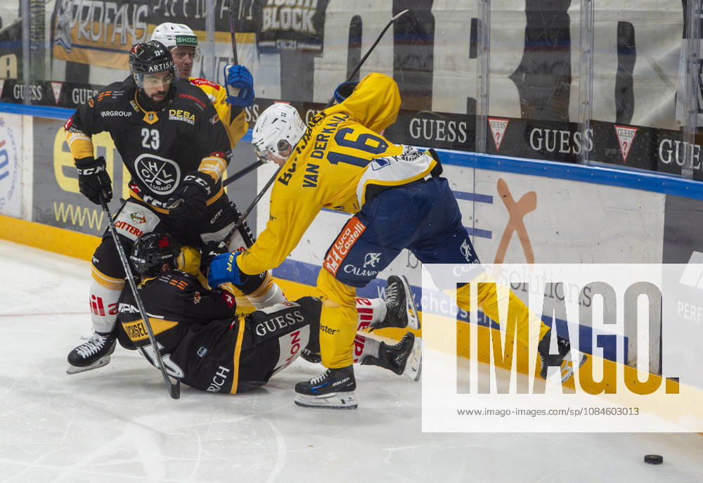 LUGANO, SWITZERLAND OCTOBER 16 Giovanni Morini of Lugano (L) and Olle Lycksell of Lugano (C) face off against Calle Andersson of Davos (2nd from L) and Guus Van der Kaaij of Davos (R) during the game between HC Lugano and HC Davos at the Corner Arena on October 16, 2026 in Lugano, Switzerland; Lugano, Ticino, Switzerland