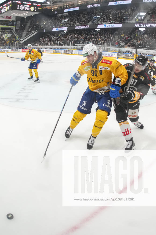 LUGANO, SWITZERLAND, OCTOBER 16: Sven Jung of Davos (L) faces off against Calvin Thurkauf of Lugano (R) during the game between HC Lugano and HC Davos at the Corner Arena on October 16, 2026, in Lugano, Switzerland (Ticino, Switzerland)