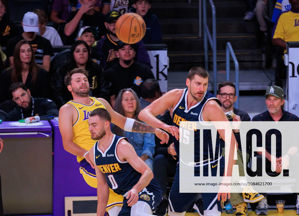 Luka Doncic 77 of the Los Angeles Lakers passes away from Nikola Jokic 15 and Christian Braun 0 of the Denver Nuggets battle for the ball during a preseason NBA, Basketball Herren, USA game on Friday, October 16, 2026, at Crypto.com Arena in Los Angeles, California. JAVIER ROJAS PI Lakers Vs. Nuggets - Preseason - ZUMAp124 20261016_zaa_p124_008