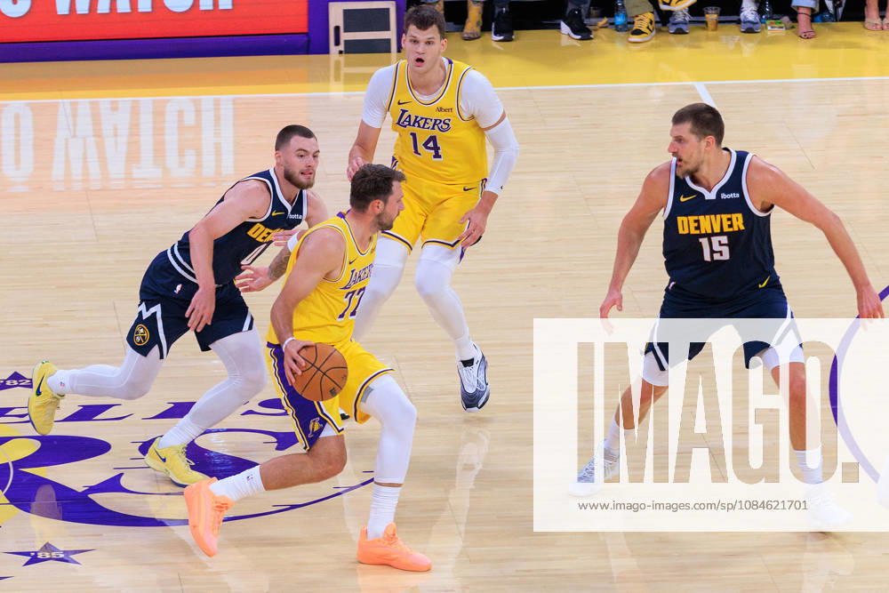 Luka Doncic 77 of the Los Angeles Lakers is defended by Nikola Jokic 15 and Christian Braun 0 of the Denver Nuggets battle for the ball during a preseason NBA, Basketball Herren, USA game on Friday, October 16, 2026, at Crypto.com Arena in Los Angeles, California. JAVIER ROJAS PI Lakers Vs. Nuggets - Preseason - ZUMAp124 20261016_zaa_p124_009