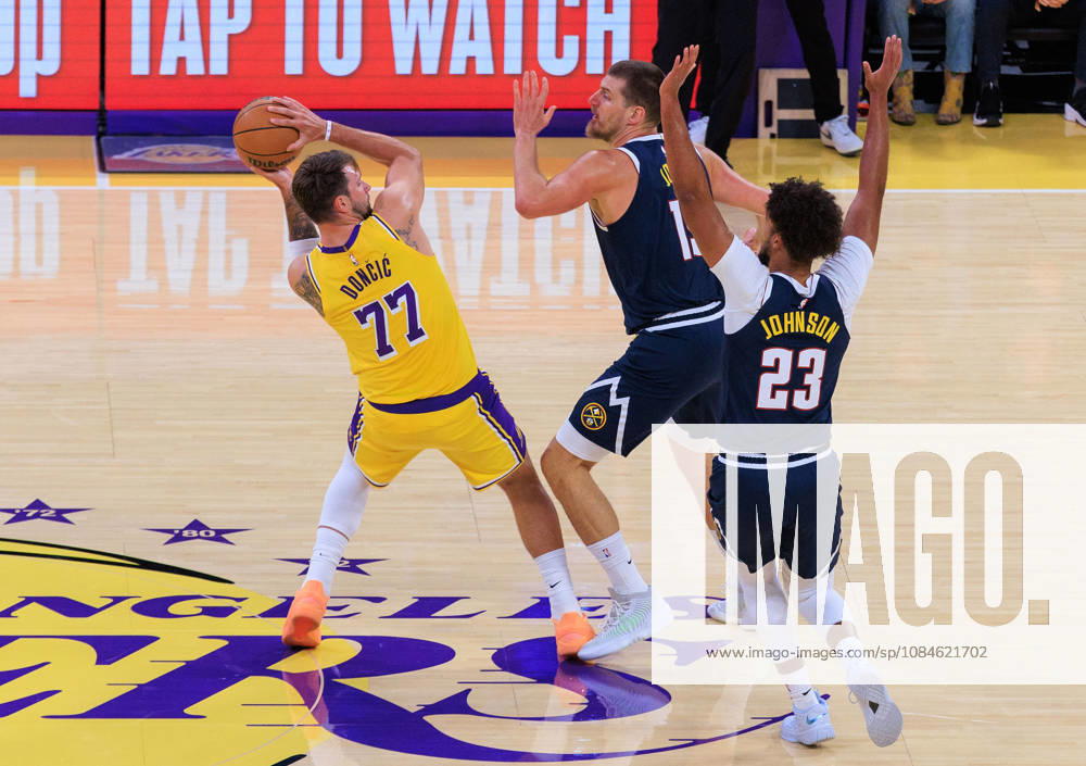 Luka Doncic 77 of the Los Angeles Lakers is guarded by Nikola Jokic 15 and Cameron Johnson 23 of the Denver Nuggets during a preseason NBA, Basketball Herren, USA game on Friday, October 16, 2026, at Crypto.com Arena in Los Angeles, California. JAVIER ROJAS PI Lakers Vs. Nuggets - Preseason - ZUMAp124 20261016_zaa_p124_011