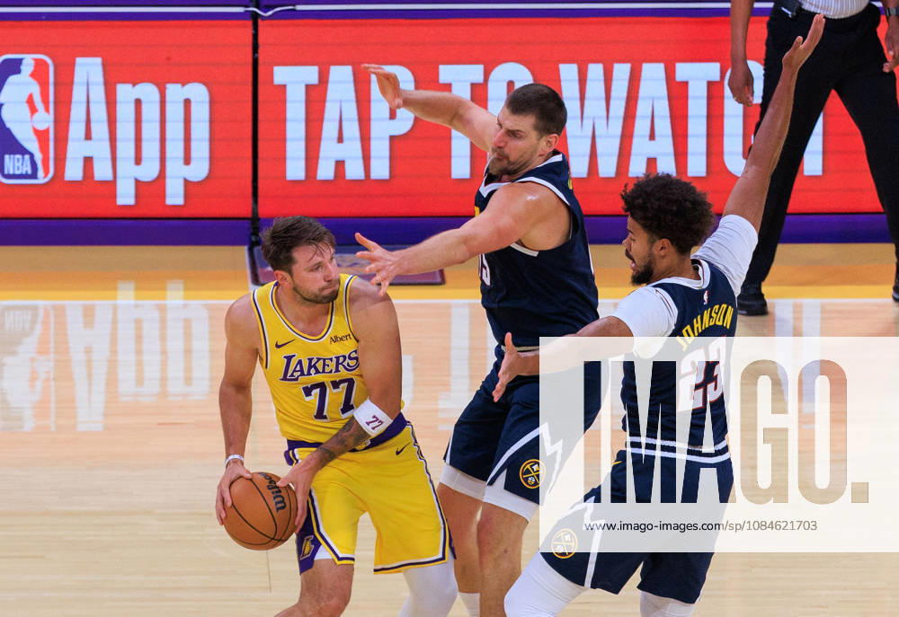 Luka Doncic 77 of the Los Angeles Lakers is guarded by Nikola Jokic 15 and Cameron Johnson 23 of the Denver Nuggets during a preseason NBA, Basketball Herren, USA game on Friday, October 16, 2026, at Crypto.com Arena in Los Angeles, California. JAVIER ROJAS PI Lakers Vs. Nuggets - Preseason - ZUMAp124 20261016_zaa_p124_012