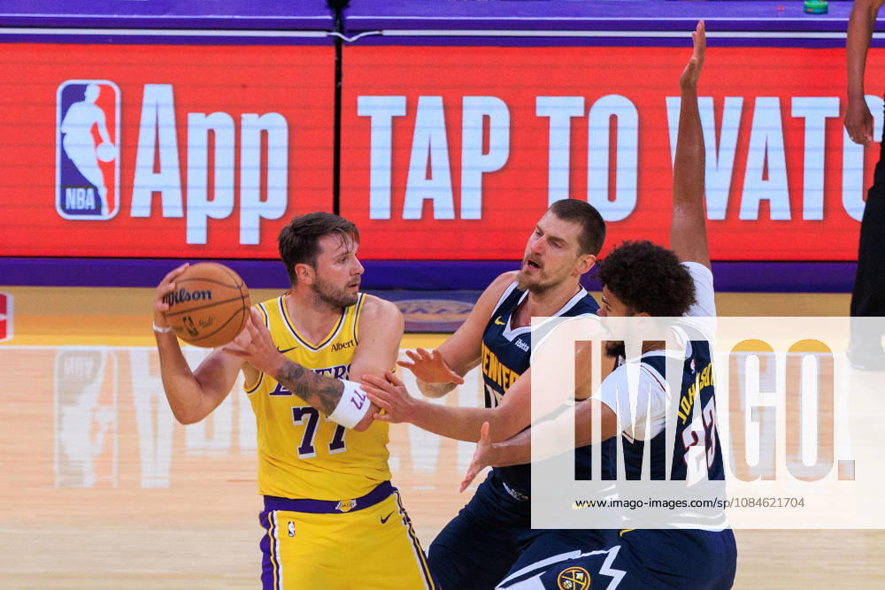 Luka Doncic 77 of the Los Angeles Lakers is guarded by Nikola Jokic 15 and Cameron Johnson 23 of the Denver Nuggets during a preseason NBA, Basketball Herren, USA game on Friday, October 16, 2026, at Crypto.com Arena in Los Angeles, California. JAVIER ROJAS PI Lakers Vs. Nuggets - Preseason - ZUMAp124 20261016_zaa_p124_013
