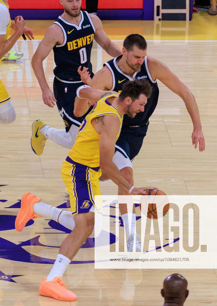 Luka Doncic 77 of the Los Angeles Lakers looks to get past Nikola Jokic 15 of the Denver Nuggets during a preseason NBA, Basketball Herren, USA game on Friday, October 16, 2026, at Crypto.com Arena in Los Angeles, California. JAVIER ROJAS PI Lakers Vs. Nuggets - Preseason - ZUMAp124 20261016_zaa_p124_014