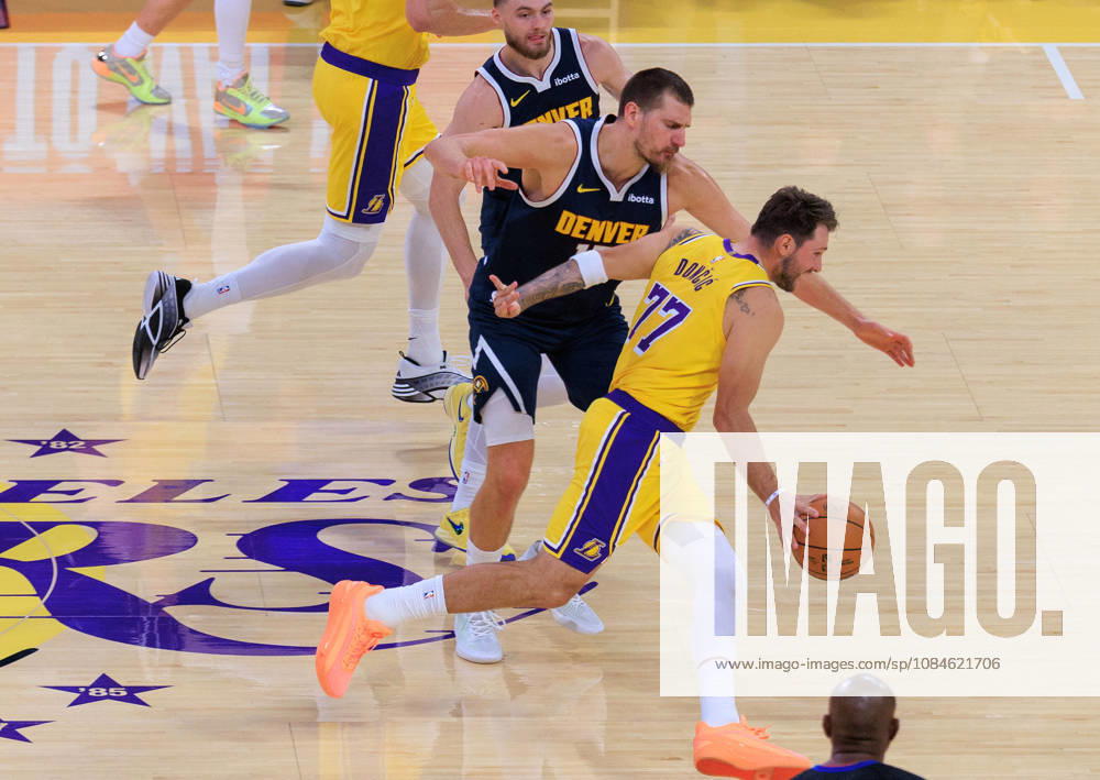 Luka Doncic 77 of the Los Angeles Lakers looks to get past Nikola Jokic 15 of the Denver Nuggets during a preseason NBA, Basketball Herren, USA game on Friday, October 16, 2026, at Crypto.com Arena in Los Angeles, California. JAVIER ROJAS PI Lakers Vs. Nuggets - Preseason - ZUMAp124 20261016_zaa_p124_015