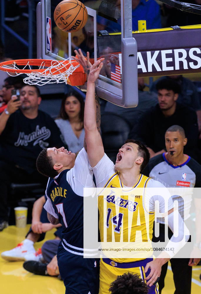 Walker Kessler 14 of the Los Angeles Lakers is blocked by Trevon Brazile 7 of the Denver Nuggets during a preseason NBA, Basketball Herren, USA game on Friday October 16, 2026 at Crypto.com Arena in Los Angeles, California. Lakers lose to Nuggets, 106-121. JAVIER ROJAS PI Lakers Vs. Nuggets - Preseason - ZUMAp124 20261016_zaa_p124_043