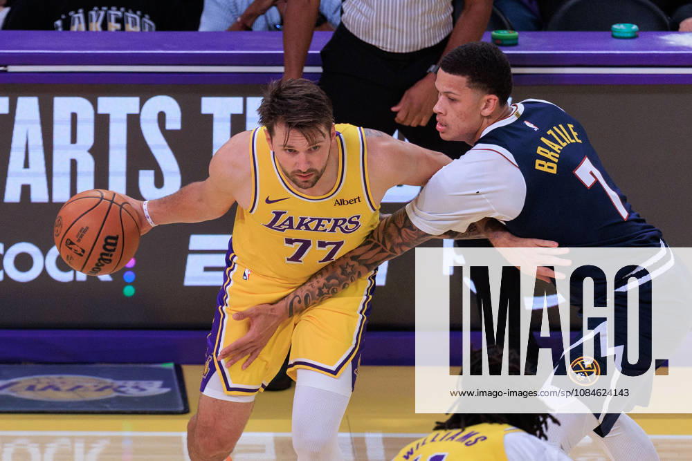 Luka Doncic 77 of the Los Angeles Lakers is guarded by Trevon Brazile 7 of the Denver Nuggets during a preseason NBA, Basketball Herren, USA game on Friday October 16, 2026 at Crypto.com Arena in Los Angeles, California. Lakers lose to Nuggets, 106-121. JAVIER ROJAS PI Lakers Vs. Nuggets - Preseason - ZUMAp124 20261016_zaa_p124_044