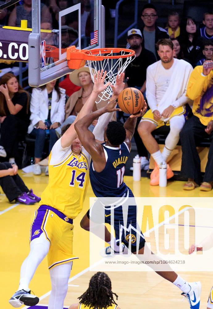 Walker Kessler 14 of the Los Angeles Lakers tries to block a layup by Alpha Diallo 11 of the Denver Nuggets during a preseason NBA, Basketball Herren, USA game on Friday October 16, 2026 at Crypto.com Arena in Los Angeles, California. Lakers lose to Nuggets, 106-121. JAVIER ROJAS PI Lakers Vs. Nuggets - Preseason - ZUMAp124 20261016_zaa_p124_054