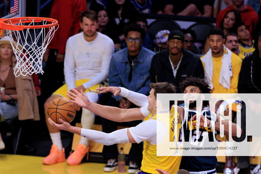 Walker Kessler 14 of the Los Angeles Lakers is defended by Jamal Murray 27 of the Denver Nuggets during a preseason NBA, Basketball Herren, USA game on Friday October 16, 2026 at Crypto.com Arena in Los Angeles, California. Lakers lose to Nuggets, 106-121. JAVIER ROJAS PI Lakers Vs. Nuggets - Preseason - ZUMAp124 20261016_zaa_p124_057