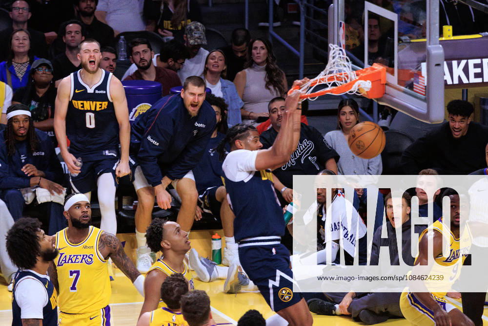 Nikola Jokic 15 of the Denver Nuggets and teammates react after Bryce Hopkins 13 dunks the ball during a preseason NBA, Basketball Herren, USA game against the Los Angeles Lakers on Friday October 16, 2026 at Crypto.com Arena in Los Angeles, California. Lakers lose to Nuggets, 106-121. JAVIER ROJAS PI Lakers Vs. Nuggets - Preseason - ZUMAp124 20261016_zaa_p124_063