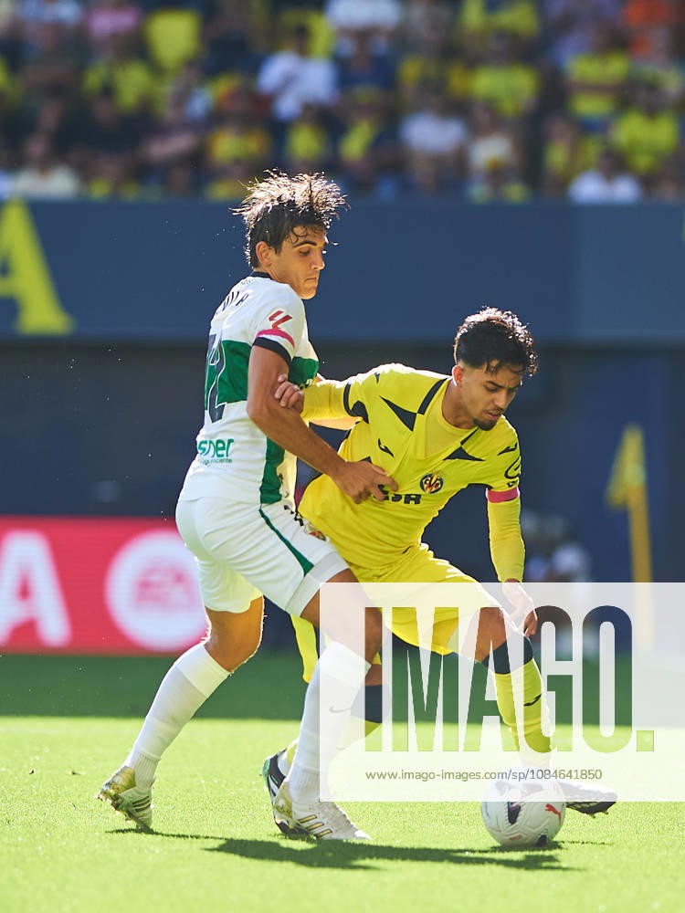 Gonzalo Villar of Elche CF and Ilias Akhomach of Villarreal CF during the LaLiga EA Sports match between Villarreal CF and Elche CF at Estadio de la Cerámica on October 17, 2026, in Villarreal, Spain