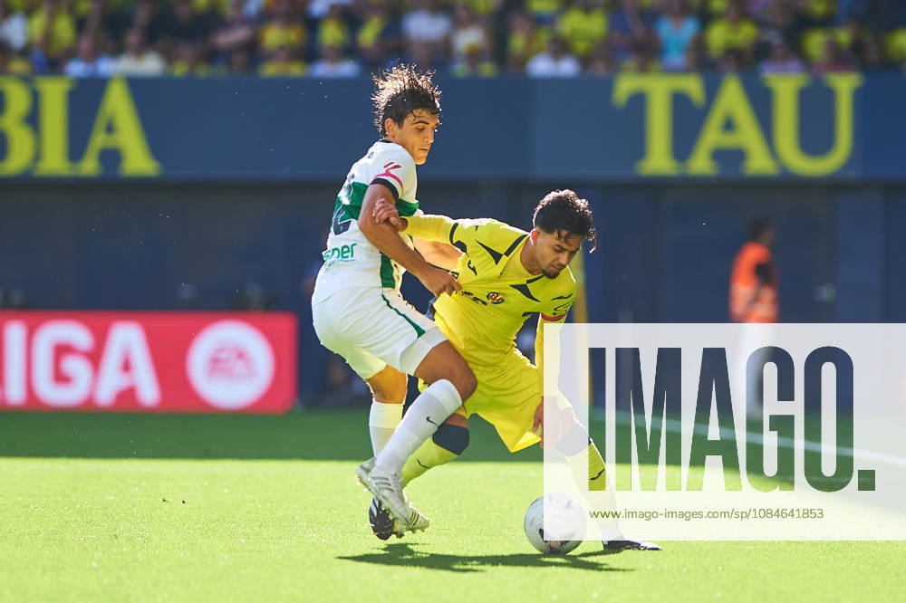 Gonzalo Villar of Elche CF and Ilias Akhomach of Villarreal CF during the LaLiga EA Sports match between Villarreal CF and Elche CF at Estadio de la Cerámica on October 17, 2026, in Villarreal, Spain