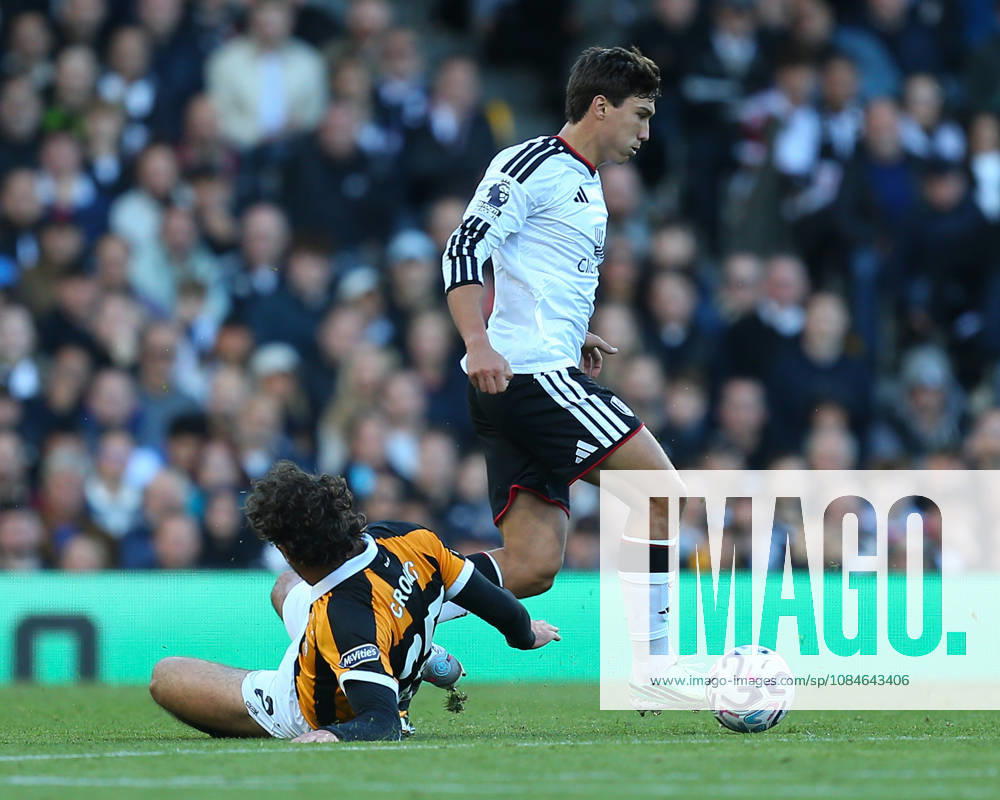 Gonzalo García of Fulham glides past challenge from Matt Crooks of Hull City during the Premier League match between Fulham and Hull City at Craven Cottage on October 17, 2026 in London, England.