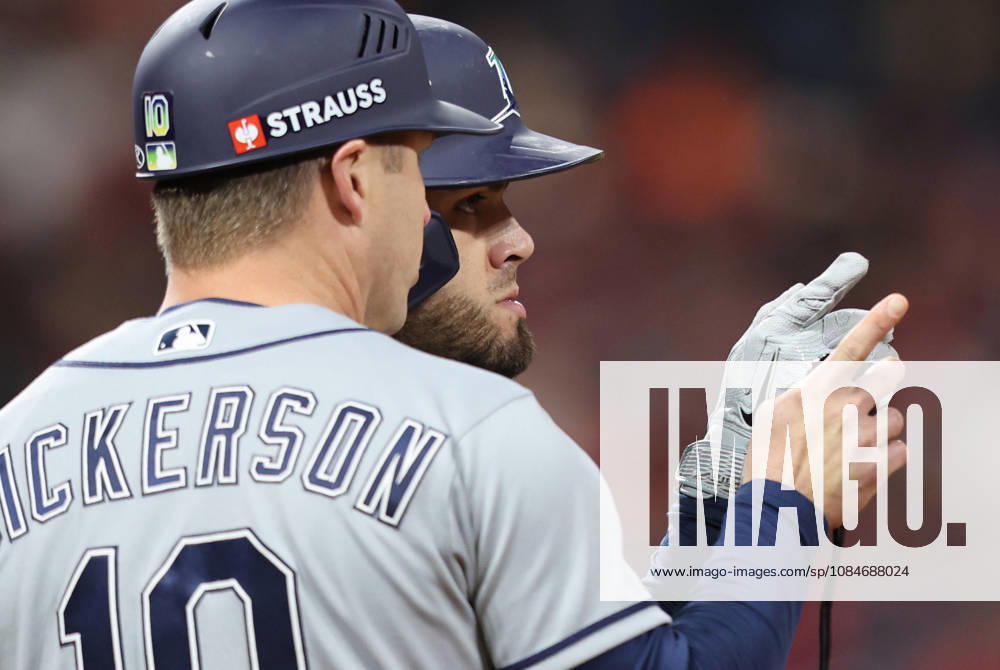 Tampa Bay Rays Jonathan Aranda (8) talks to first base coach Corey Dickerson (10) after walking against the Cleveland Guardians in the sixth inning during game four of the MLB, Baseball Herren, USA American League Championship Series at Progressive Field in Cleveland, Ohio, on Saturday, October 17, 2026. CLE20261017720 AARONxJOSEFCZYK