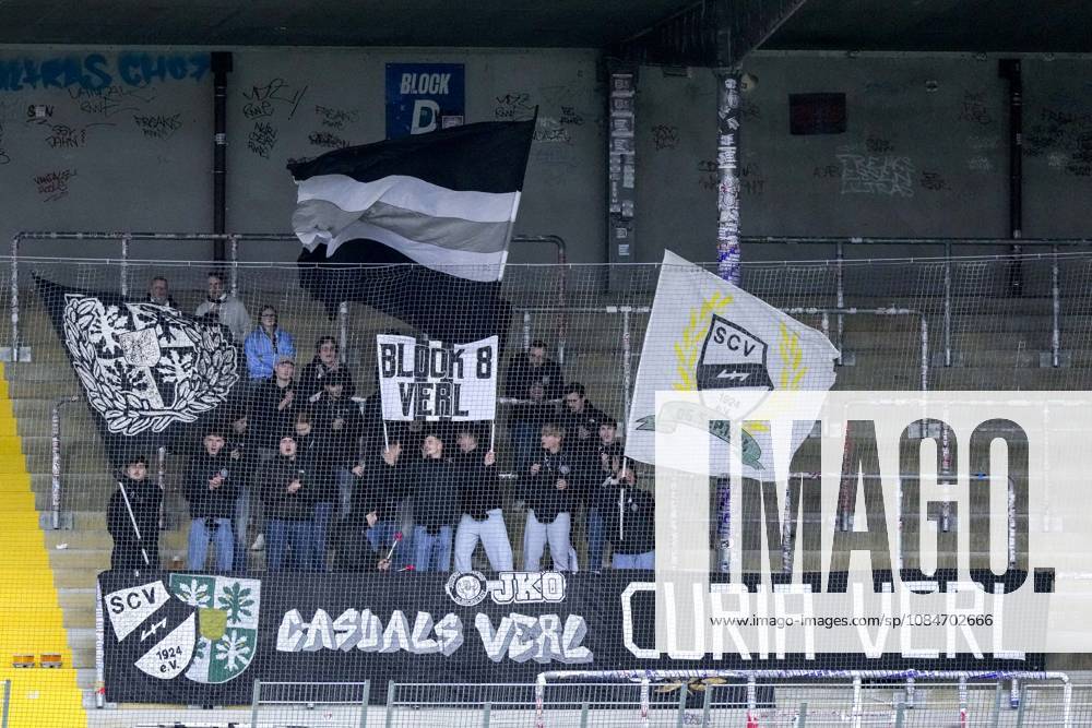 The SC Verl ultras who traveled with the team are waving their flags in the fan section; visiting fans, visiting section, visitors, fan section, looking forward to the game; fans, audience, spectators, mood, atmosphere, stadium, October 18, 2026, Sinsheim, Germany, soccer, 3rd Division, TSG 1899 Hoffenheim II vs. SC Verl; DFB and DFL regulations prohibit any use of photographs as image sequences and or quasi-video