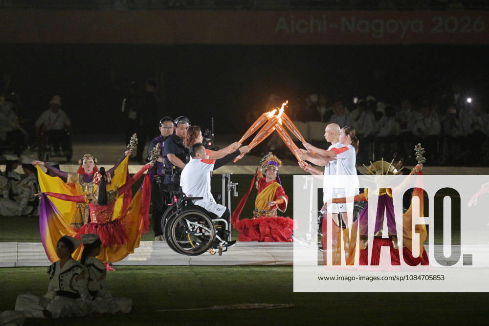 (261018) -- NAGOYA, Oct. 18, 2026 -- Torch bearers hand over the flame during the opening ceremony of the Aichi-Nagoya Asian Para Games in Nagoya, Japan, Oct. 18, 2026. ) (SP)JAPAN-NAGOYA-ASIAN PARA GAMES-OPENING CEREMONY ThenxChihxWey